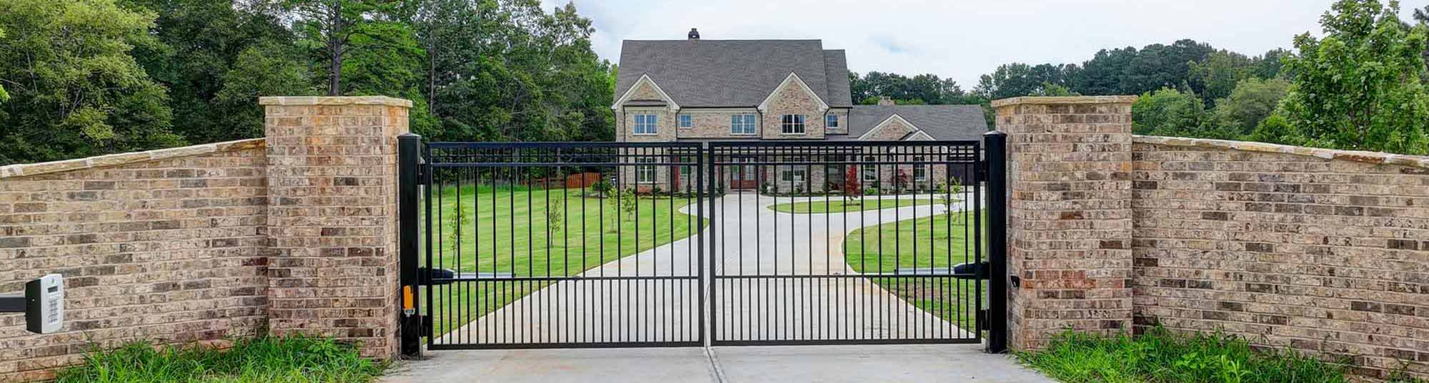 OMZ HomZ Custom Home Build - Front Gate with Home